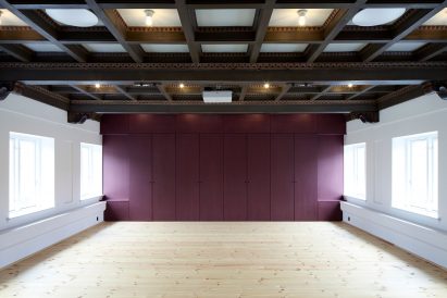 Leth & Gori converts Copenhagen chapel into cancer-care facility featuring colourful painted joinery