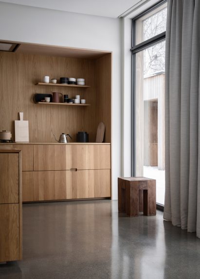 This family home by Danish practice Norm Architects is filled with cosy nooks and opening living areas with generous windows to give views out over picturesque woodland and a lake set around an hour's drive north of Oslo.
