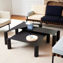 Max Enrich pairs bulky legs with slender surfaces to create nesting coffee tables