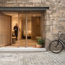 Old Edinburgh workshop transformed into minimal holiday retreat by Izat Arundell