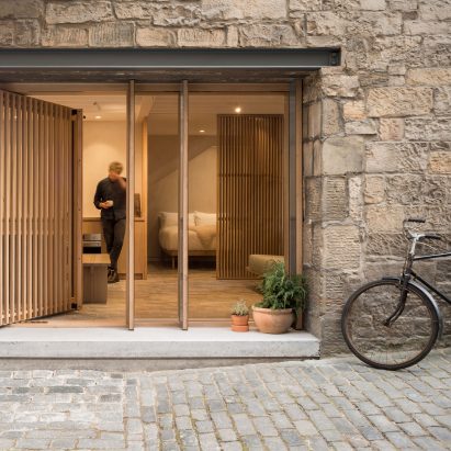 Old Edinburgh workshop transformed into minimal holiday retreat by Izat Arundell