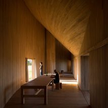 Rode House by Pezo Von Ellrichshausen curves around a paved courtyard