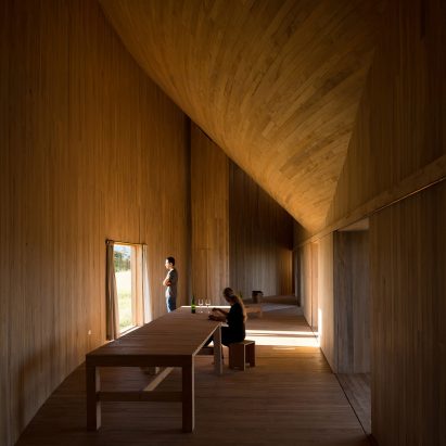 Rode House by Pezo Von Ellrichshausen curves around a paved courtyard