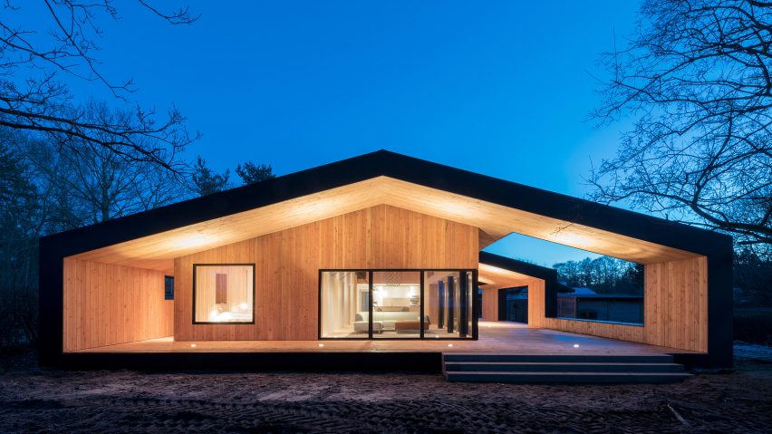 Oversized roof shelters terraces on either side of CEBRA’s Danish summer house
