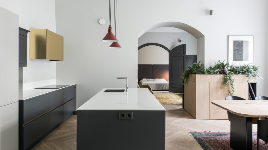 Brass accents and contemporary cabinetry update 19th-century apartment in Vilnius