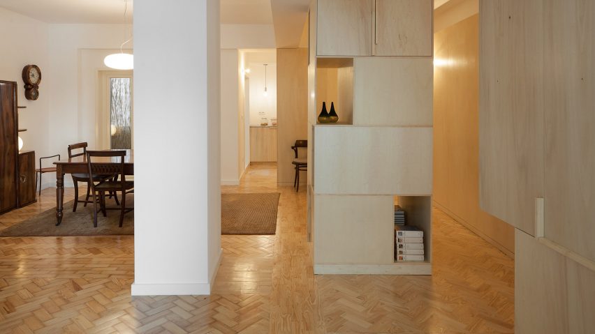 Cubículo Arquitectos installs birch-plywood storage units inside Porto flat