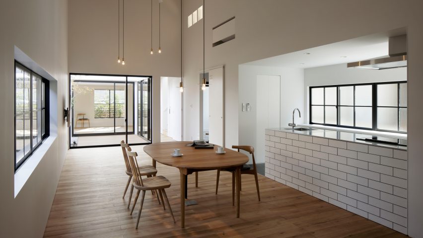 Deceptively industrial facade conceals bright contemporary home in Japan