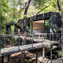 Wernerfield elevates Treebox guest house on wooded site in Texas
