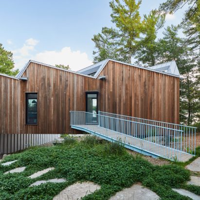 Sawtooth roof tops lakefront home in Canada by Julia Jamrozik and Coryn Kempster
