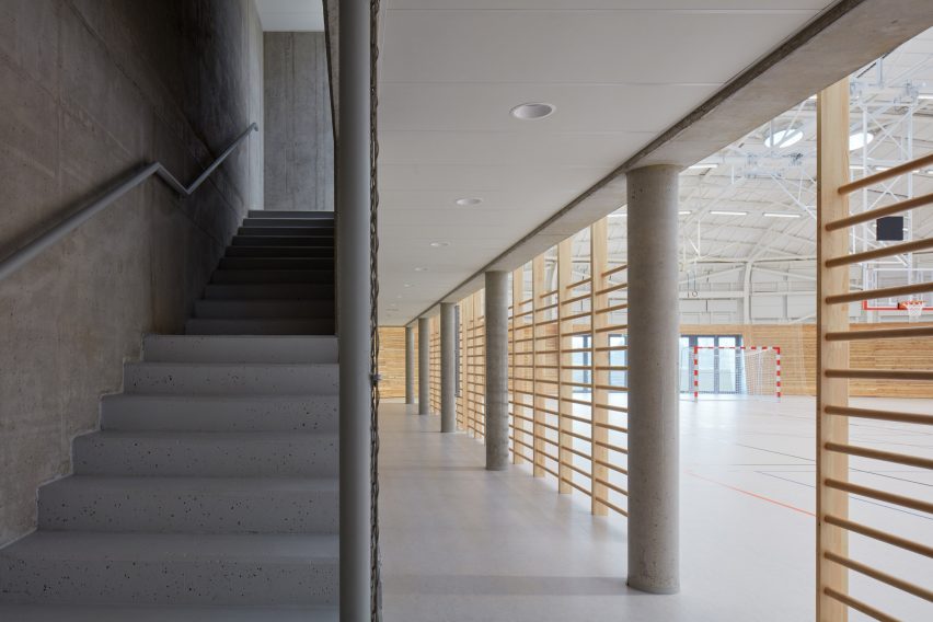 The sports hall designed by local architecture office Sporadical adjoins a recently modernised and extended primary school in the town of Dolní Břežany
