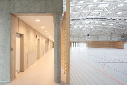 The sports hall designed by local architecture office Sporadical adjoins a recently modernised and extended primary school in the town of Dolní Břežany