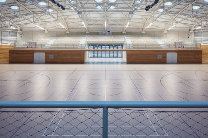 The sports hall designed by local architecture office Sporadical adjoins a recently modernised and extended primary school in the town of Dolní Břežany