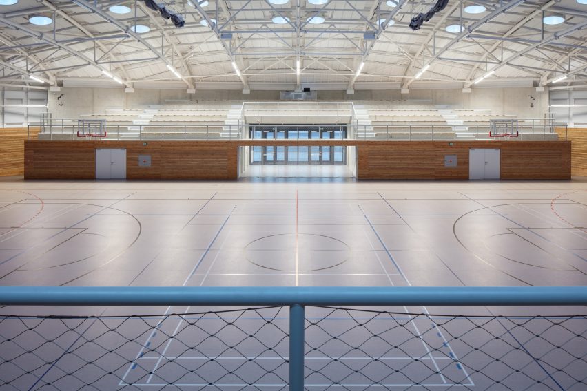 The sports hall designed by local architecture office Sporadical adjoins a recently modernised and extended primary school in the town of Dolní Břežany