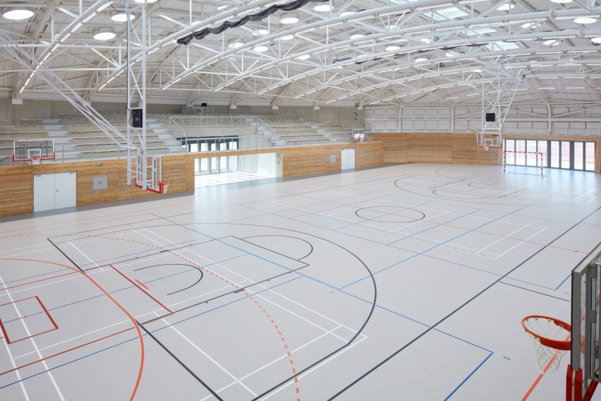 The sports hall designed by local architecture office Sporadical adjoins a recently modernised and extended primary school in the town of Dolní Břežany