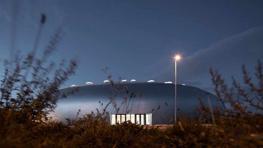 Domed sports hall by Sporadical is covered in scale-like aluminium shingles