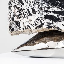 Ben Storms creates Inhale tables from metal cushions and marble slabs