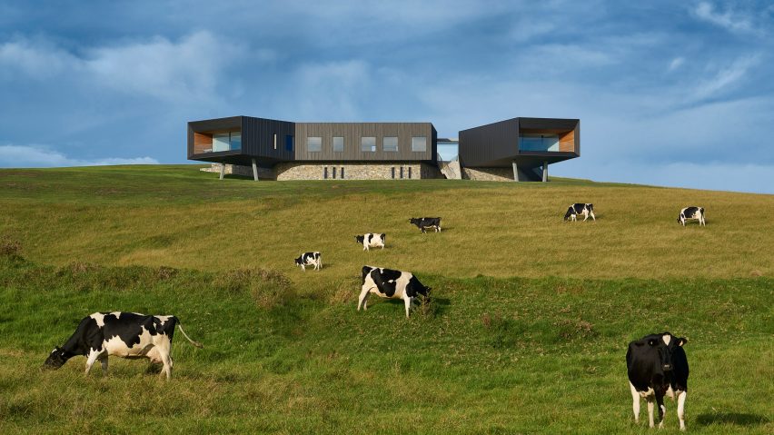 Coastal house by Atelier Andy Carson features cantilevered rooms looking out to sea