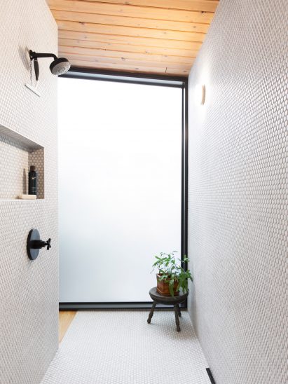 Walk-in shower with circular tiles