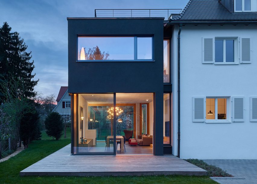 Holzer Architekten adds black extension to 1920s house in Stuttgart