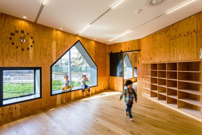 House-shaped windows puncture perforated-metal facades of Yokohama nursery
