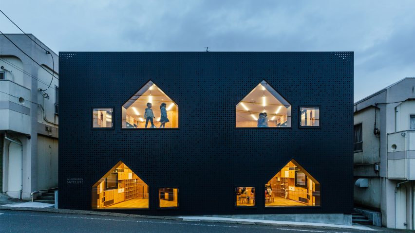 House-shaped windows puncture perforated-metal facades of Yokohama nursery