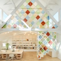 Stained glass dividers brighten London co-working space inside former church