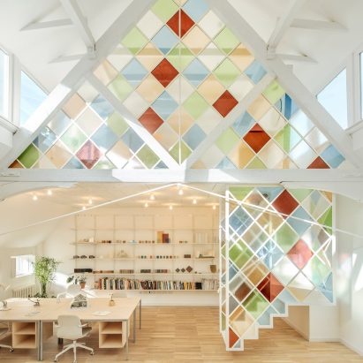 Stained glass dividers brighten London co-working space inside former church