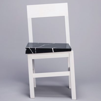 Snarkitecture’s Slip chair features wonky legs and a slanted seat