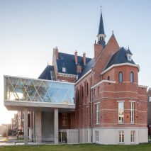 WAW Architects adds concrete extension to social services centre in former orphanage 
