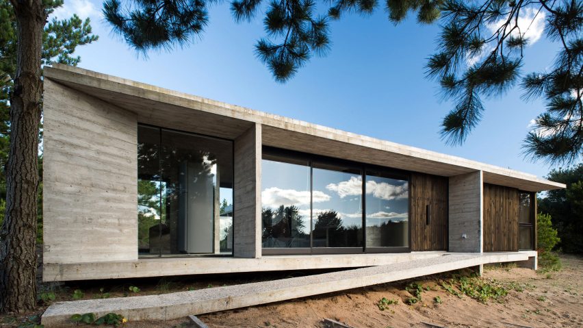Luciano Kruk combines blackened wood with concrete for Equestrian House in Argentina