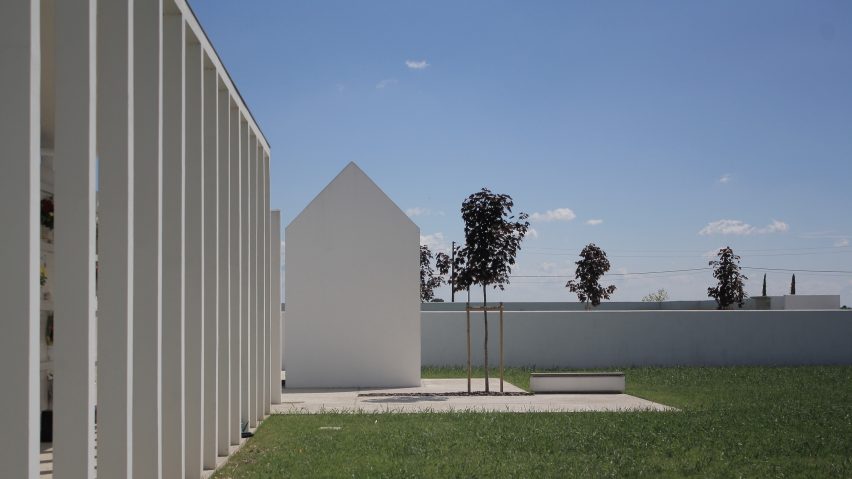 Gabled tombs sit within serene courtyards at Italian cemetery
