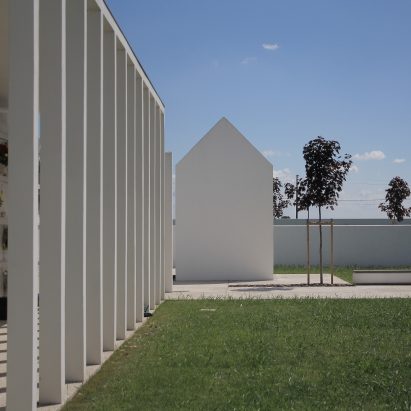 Gabled tombs sit within serene courtyards at Italian cemetery