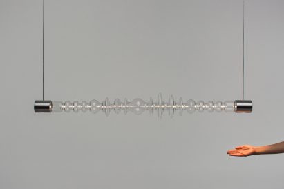 Mayice Studio creates sculptural lamp from curving glass tube