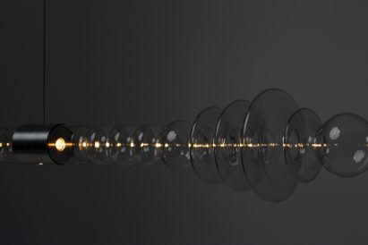 Mayice Studio creates sculptural lamp from curving glass tube