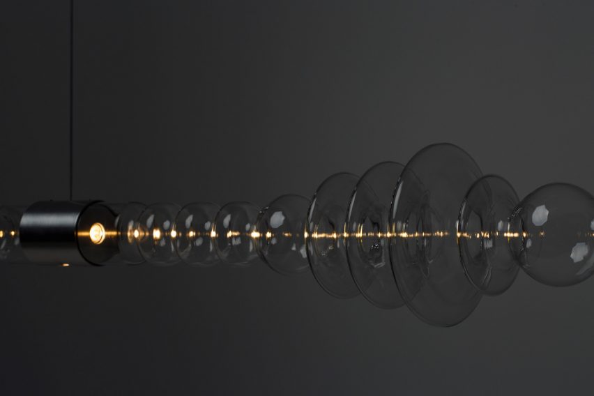 Mayice Studio creates sculptural lamp from curving glass tube