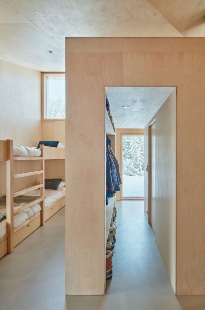 Mork-Ulnes Architects completes timber-clad house with a "pinwheel plan" in a Norwegian forest