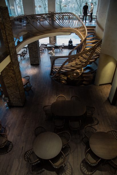 Atmos Studio's spiralling timber staircase features "leaf-like" stairs that emerge from a structural stem
