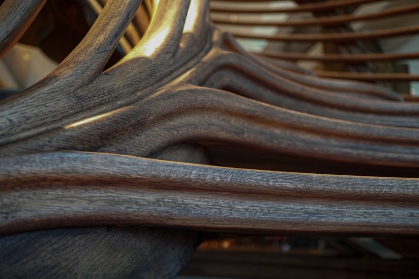 Atmos Studio's spiralling timber staircase features "leaf-like" stairs that emerge from a structural stem