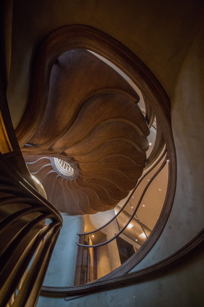 Atmos Studio's spiralling timber staircase features "leaf-like" stairs that emerge from a structural stem