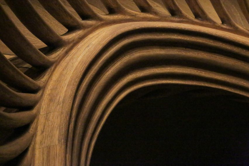 Atmos Studio's spiralling timber staircase features "leaf-like" stairs that emerge from a structural stem