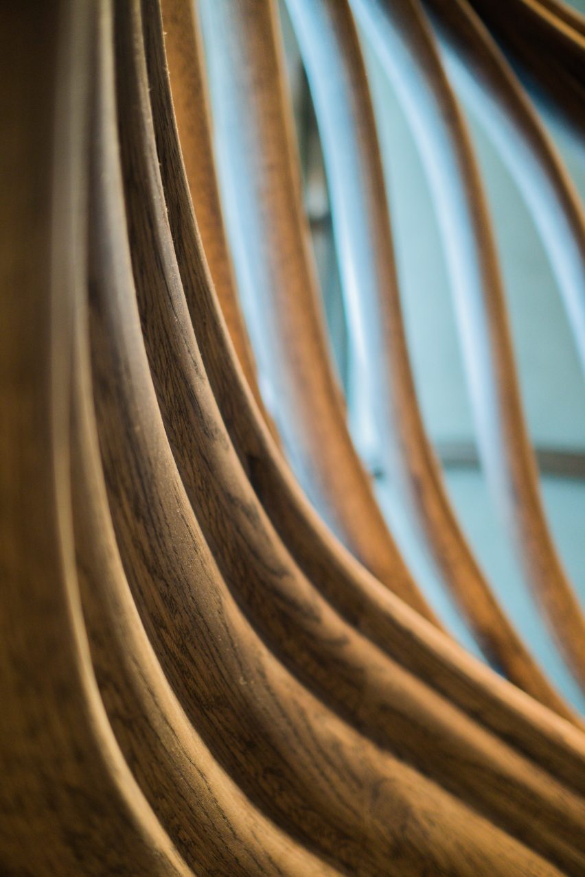Atmos Studio's spiralling timber staircase features "leaf-like" stairs that emerge from a structural stem