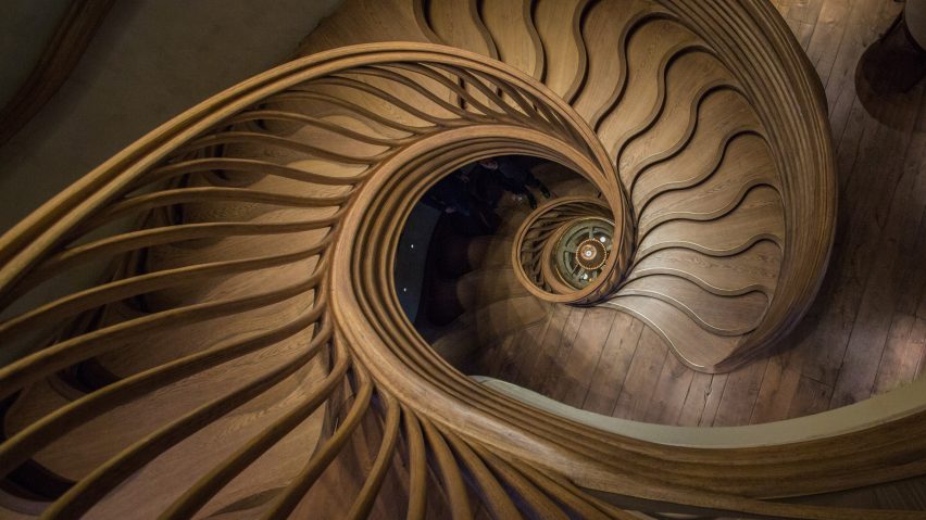 Atmos Studio's spiralling timber staircase features "leaf-like" stairs that emerge from a structural stem