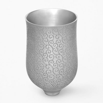 Nendo carves “four-layered” vase from a single 100-kilo block of aluminium