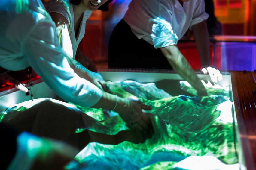Tellart designs topographic sandpit table that lets you move mountains