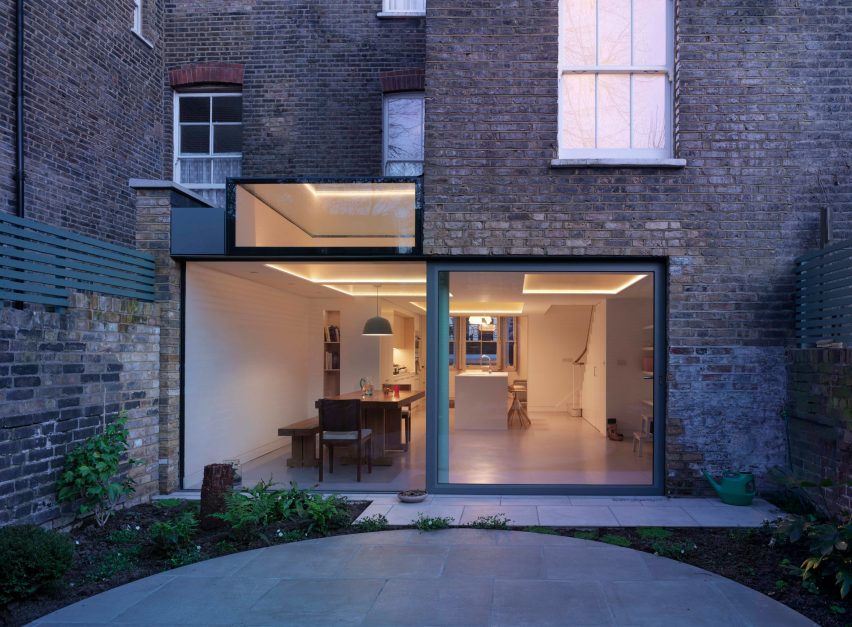 Glazed extension seamlessly connects refurbished Highbury house with new patio garden