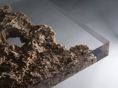 Alcarol and Vaselli create table and stools from travertine encased in resin
