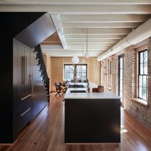 Workstead’s Carriage House features brickwork walls splattered with plaster and paint
