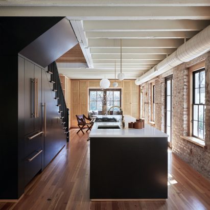 Workstead’s Carriage House features brickwork walls splattered with plaster and paint