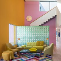 Eight home interiors furnished around statement rugs