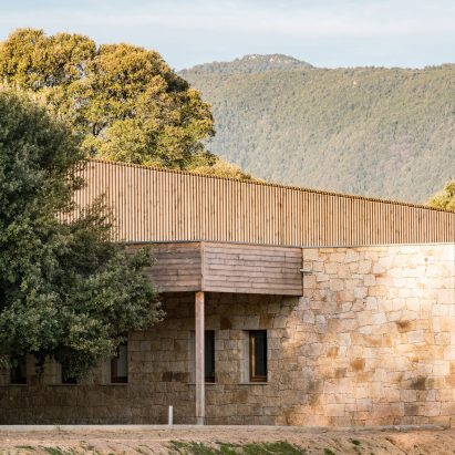 Amelia Tavella Architectes completes stone and timber school in Corsica